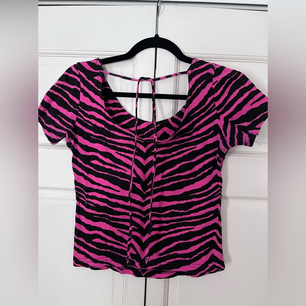Helium women’s pink and black top size m could fit small.